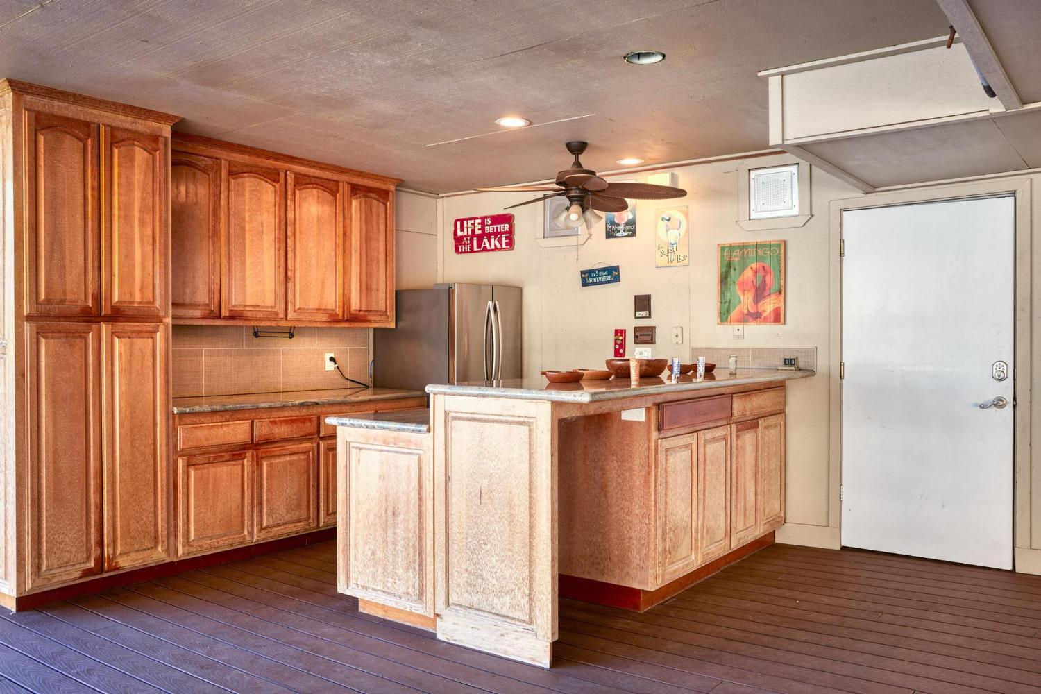 771 Mother Shipton Road Copperopolis, CA 95228 - Photo 56 of 72 Bar with granite counters & refrigerator on party deck.