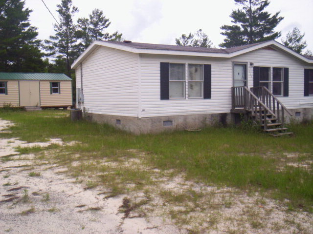 1371 Horne Road Roberta, GA 31078 - Photo 2 of 22 a view of a house with a yard patio and fire pit