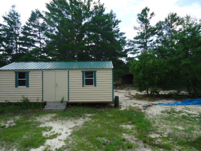 1371 Horne Road Roberta, GA 31078 - Photo 3 of 22 a view of a back yard of the house