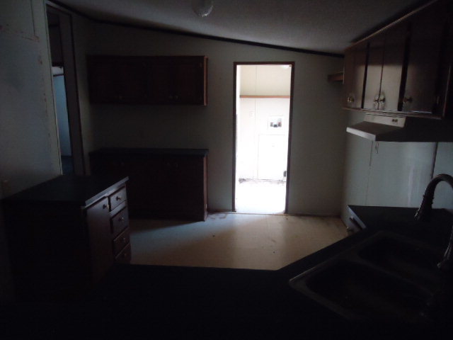 1371 Horne Road Roberta, GA 31078 - Photo 6 of 22 a kitchen with stainless steel appliances a stove and a refrigerator