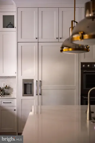 a living room with furniture a flat screen tv and a window