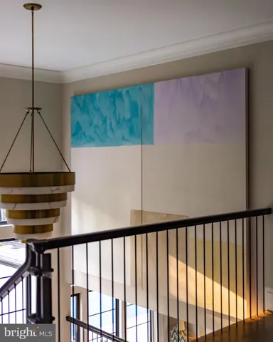 a spacious bedroom with a bed a couch and dresser