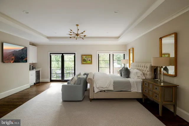 a spacious bathroom with a toilet sink and mirror