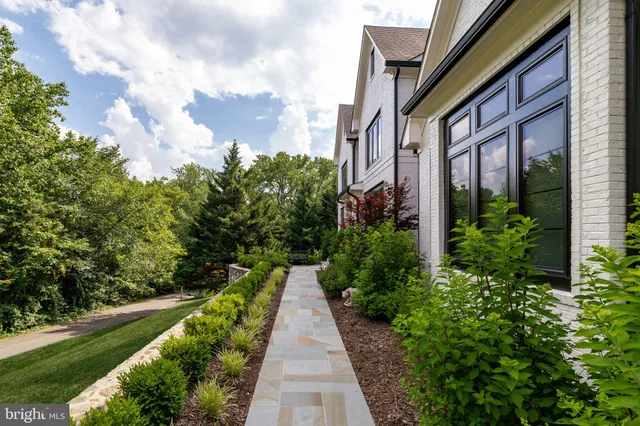 a view of a pathway both side of the house