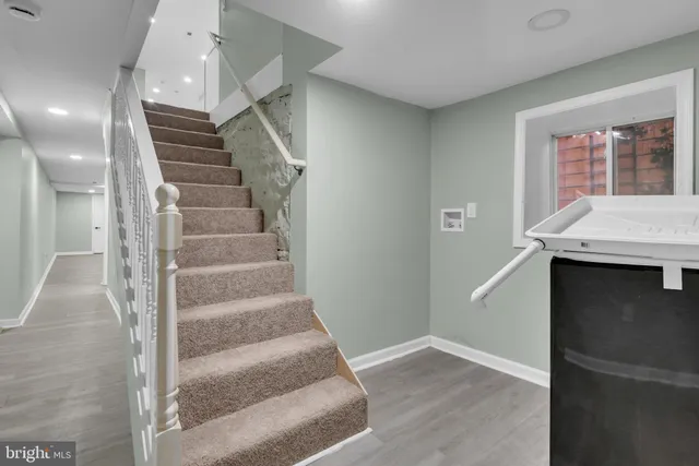 a view of room with wooden floor