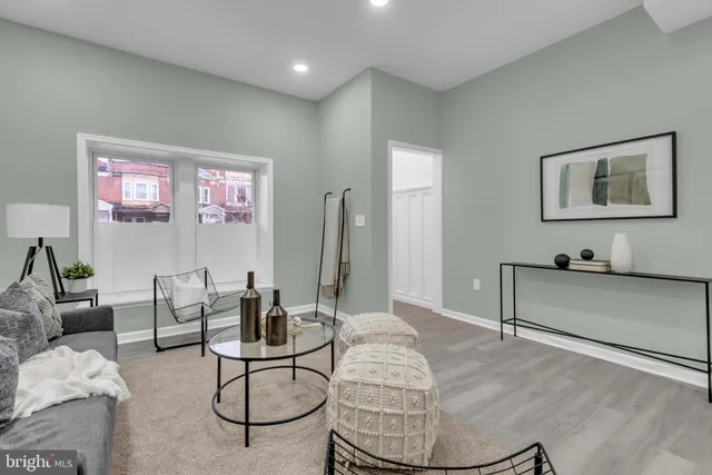 a living room with furniture and a table