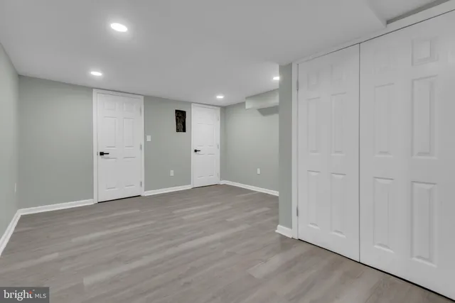 a white toilet sitting next to a bathroom sink