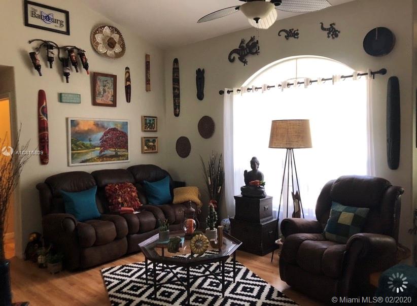 128 Kilpatrick Road Clewiston, FL 33440 - Photo 14 of 35 a living room with furniture and a fireplace