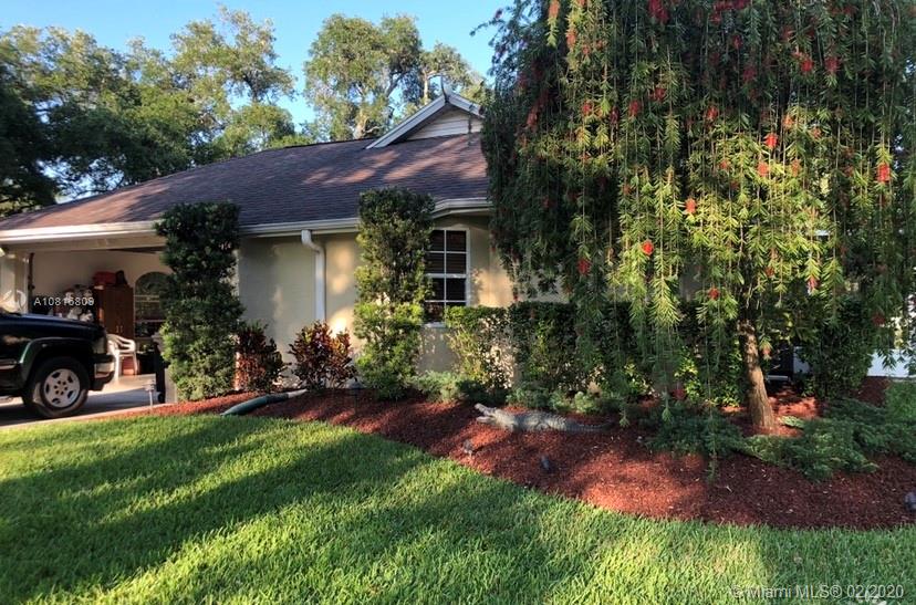 128 Kilpatrick Road Clewiston, FL 33440 - Photo 8 of 35 a view of a house with a yard and sitting area