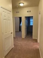 a view of room with racks on the wall