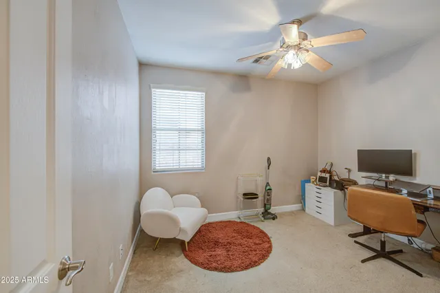 a bedroom with furniture and a window