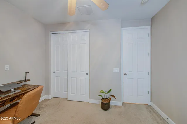 a view of an empty room and wooden floor