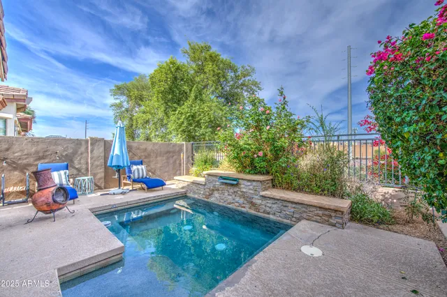 a view of a backyard with sitting area