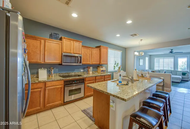 a kitchen with a sink window and cabinets