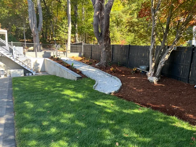 a view of a backyard with a small pool