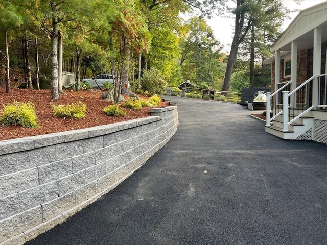 a view of a backyard with table and chairs