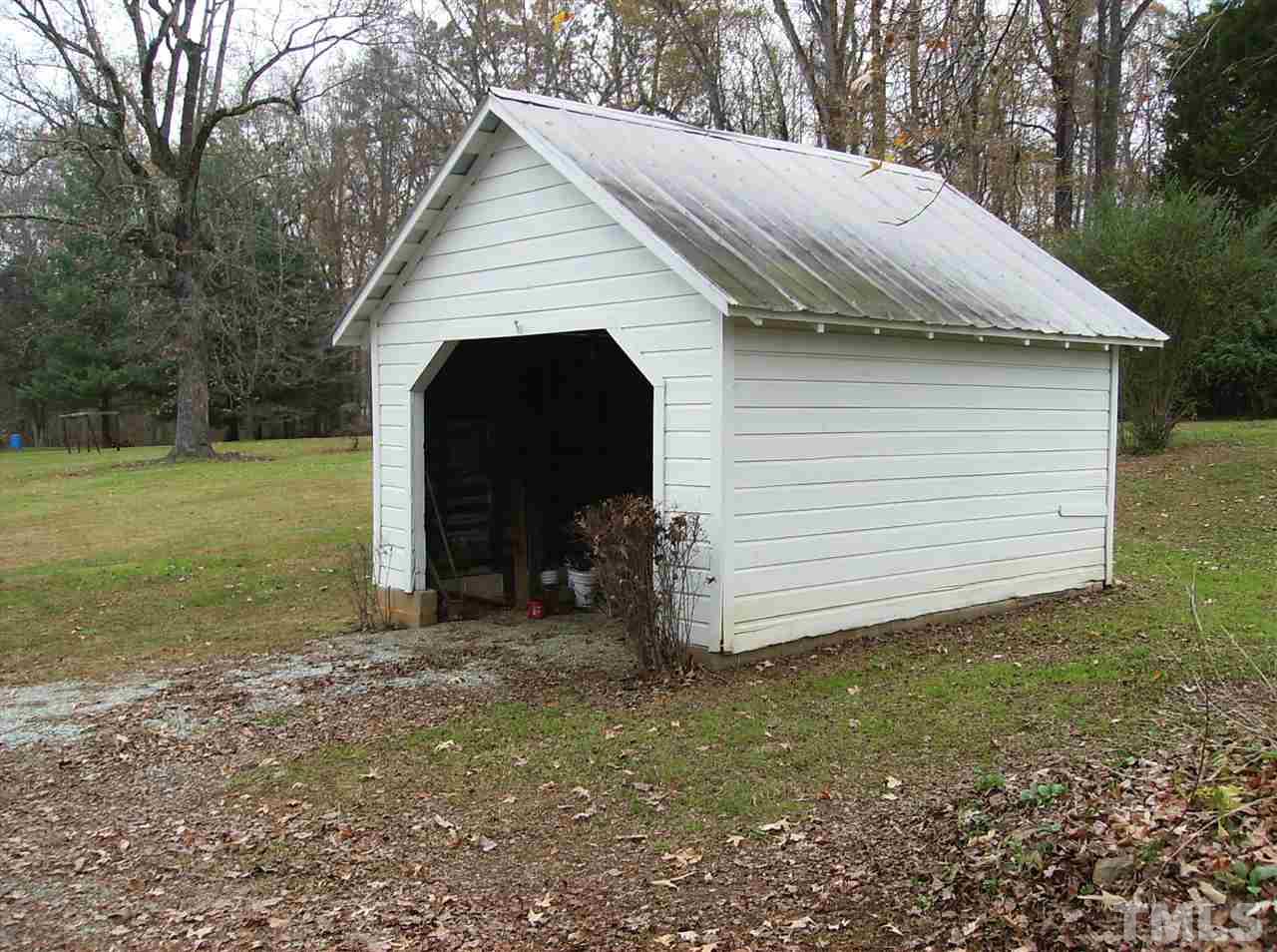4455 Oxford Road Roxboro, NC 27574 - Photo 2 of 10 a view of a small house with a yard