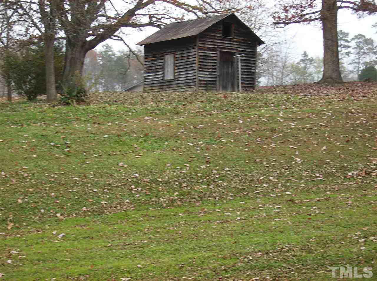 4455 Oxford Road Roxboro, NC 27574 - Photo 3 of 10 a house with a yard
