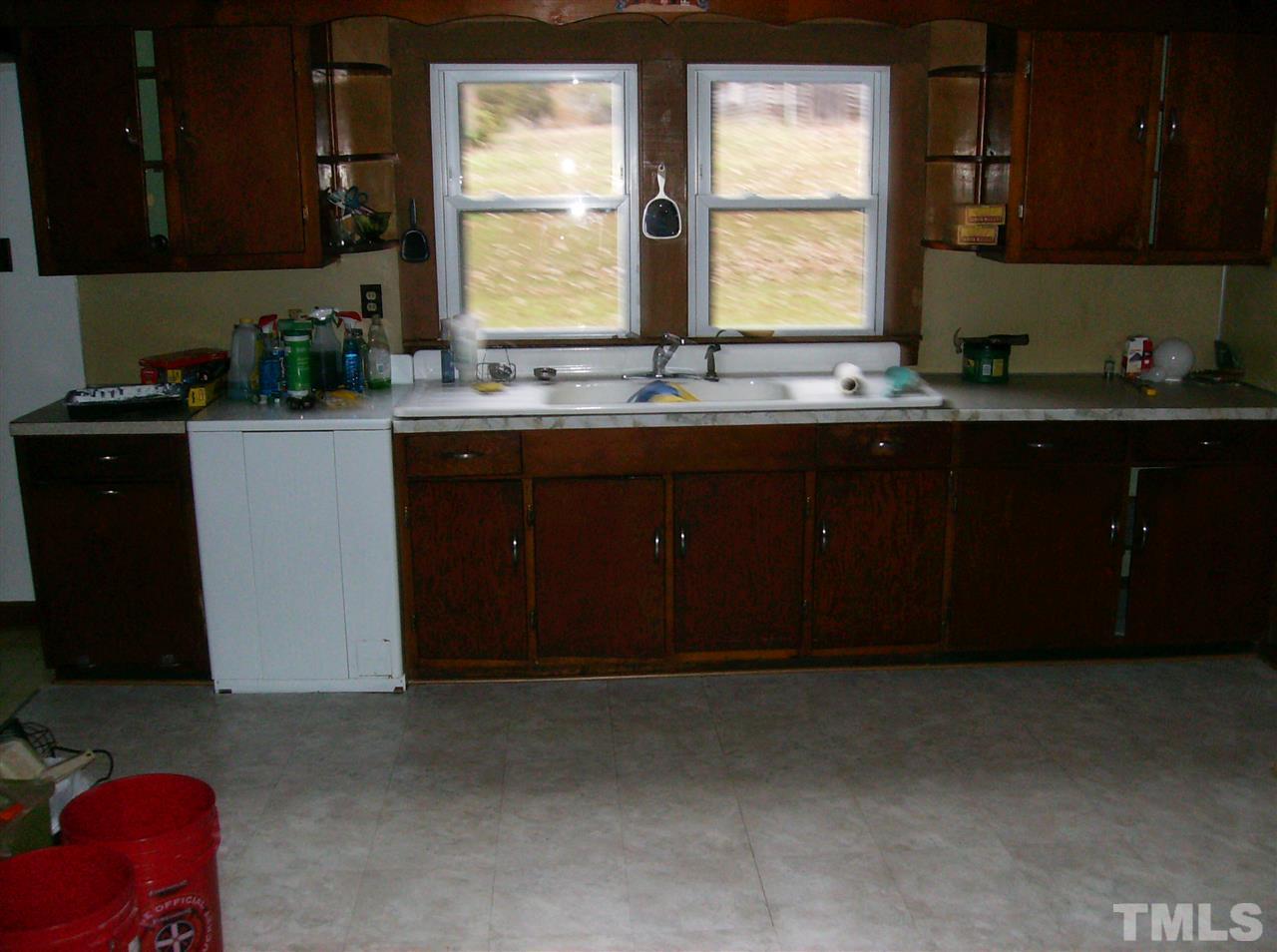 4455 Oxford Road Roxboro, NC 27574 - Photo 5 of 10 a kitchen with a sink cabinets and window