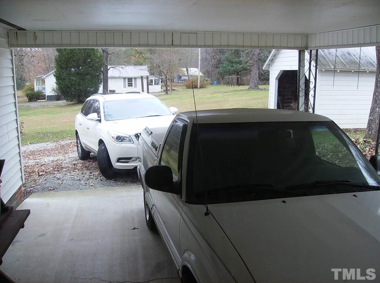 4455 Oxford Road Roxboro, NC 27574 - Photo 6 of 10 a bedroom with a bed and a window