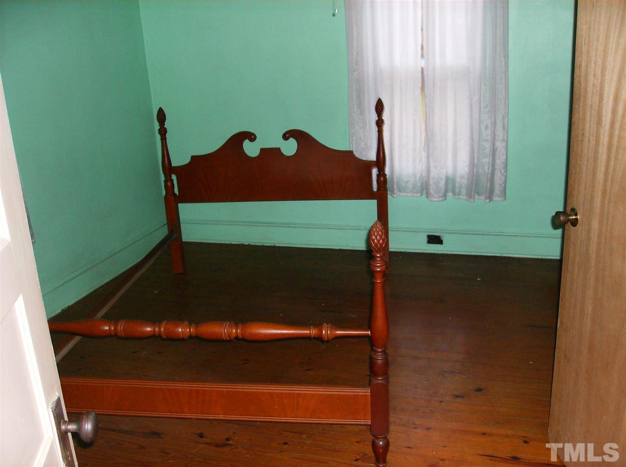 4455 Oxford Road Roxboro, NC 27574 - Photo 7 of 10 a table chair in a room next to a window