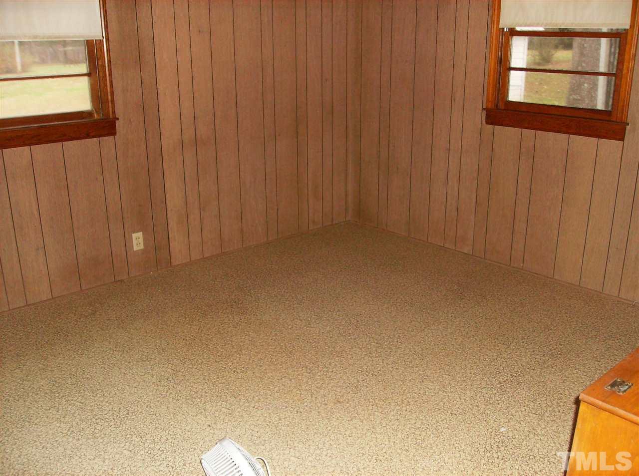 4455 Oxford Road Roxboro, NC 27574 - Photo 8 of 10 a view of an empty room and a window