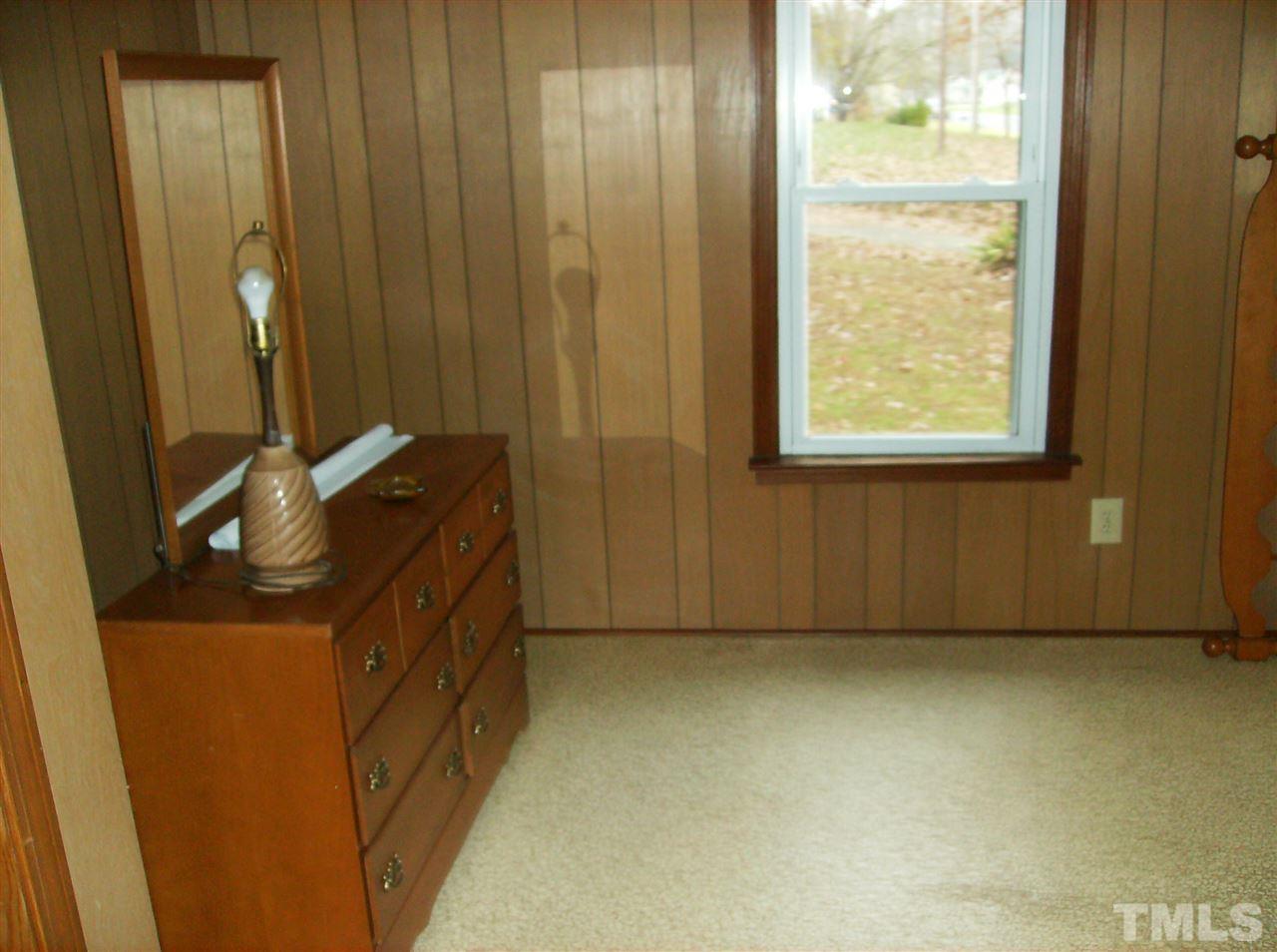 4455 Oxford Road Roxboro, NC 27574 - Photo 10 of 10 a bathroom with a granite countertop sink and a mirror