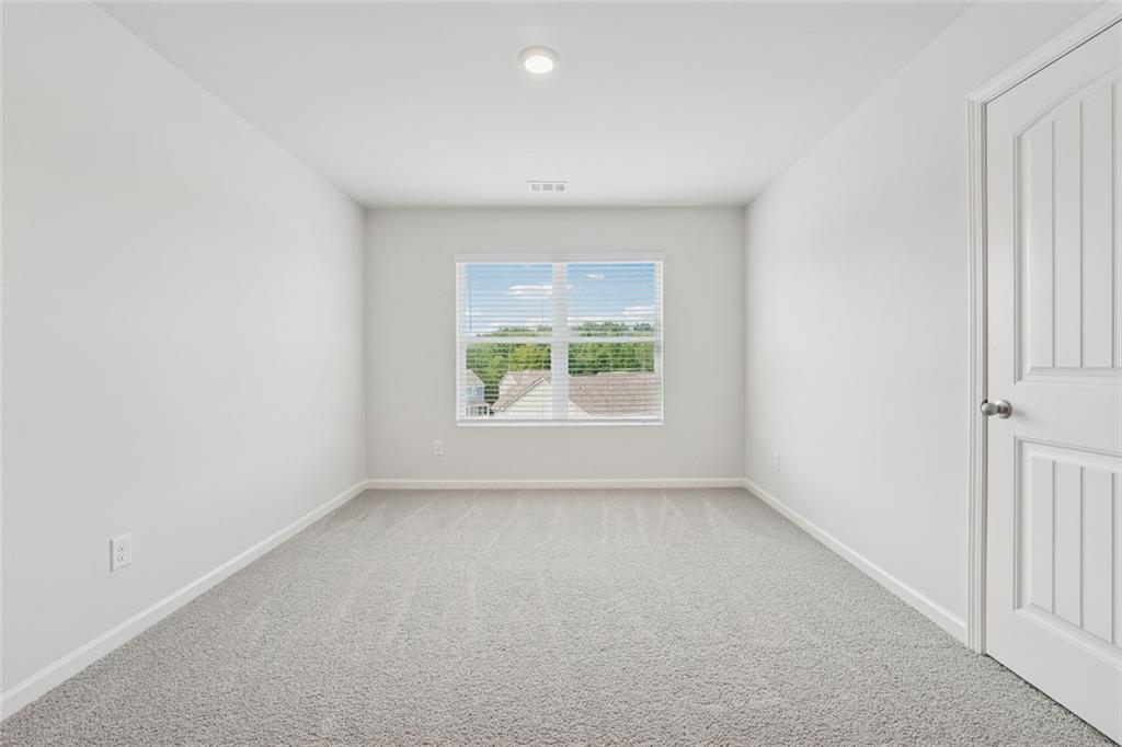 96 Quail Bend Way Dallas, GA 30157 - Photo 27 of 57 an empty room with windows