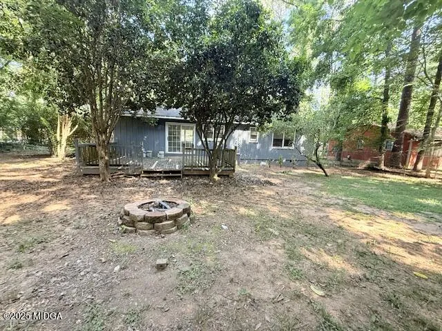 a backyard of a house with seating space