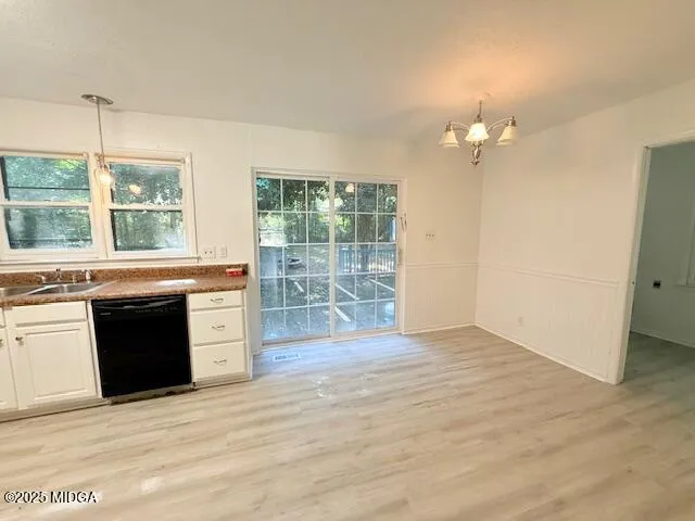 a view of a kitchen with granite countertop tops and a large window