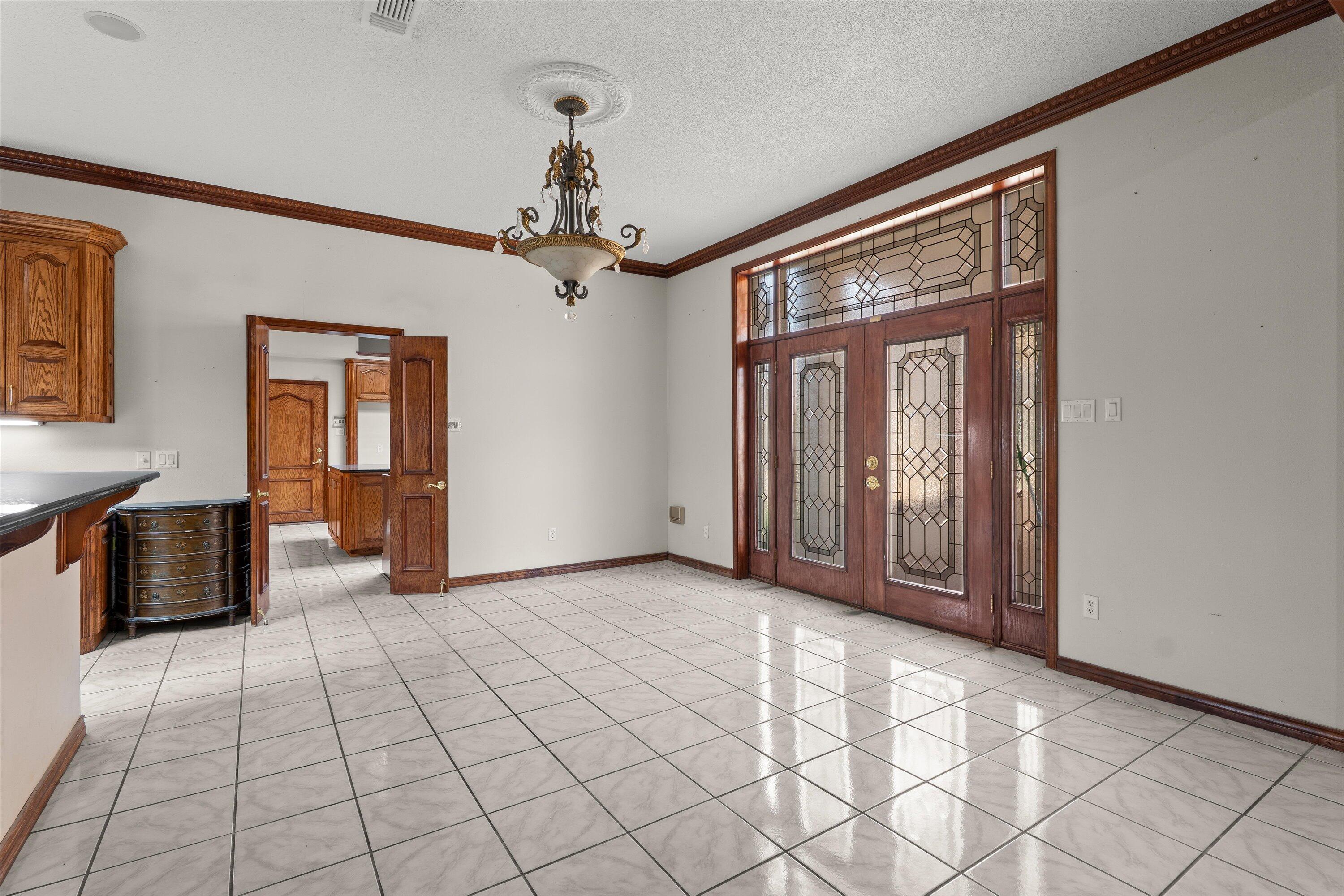 2404 York Avenue Lubbock, TX 79407 - Photo 11 of 88 a view of a livingroom with a chandelier