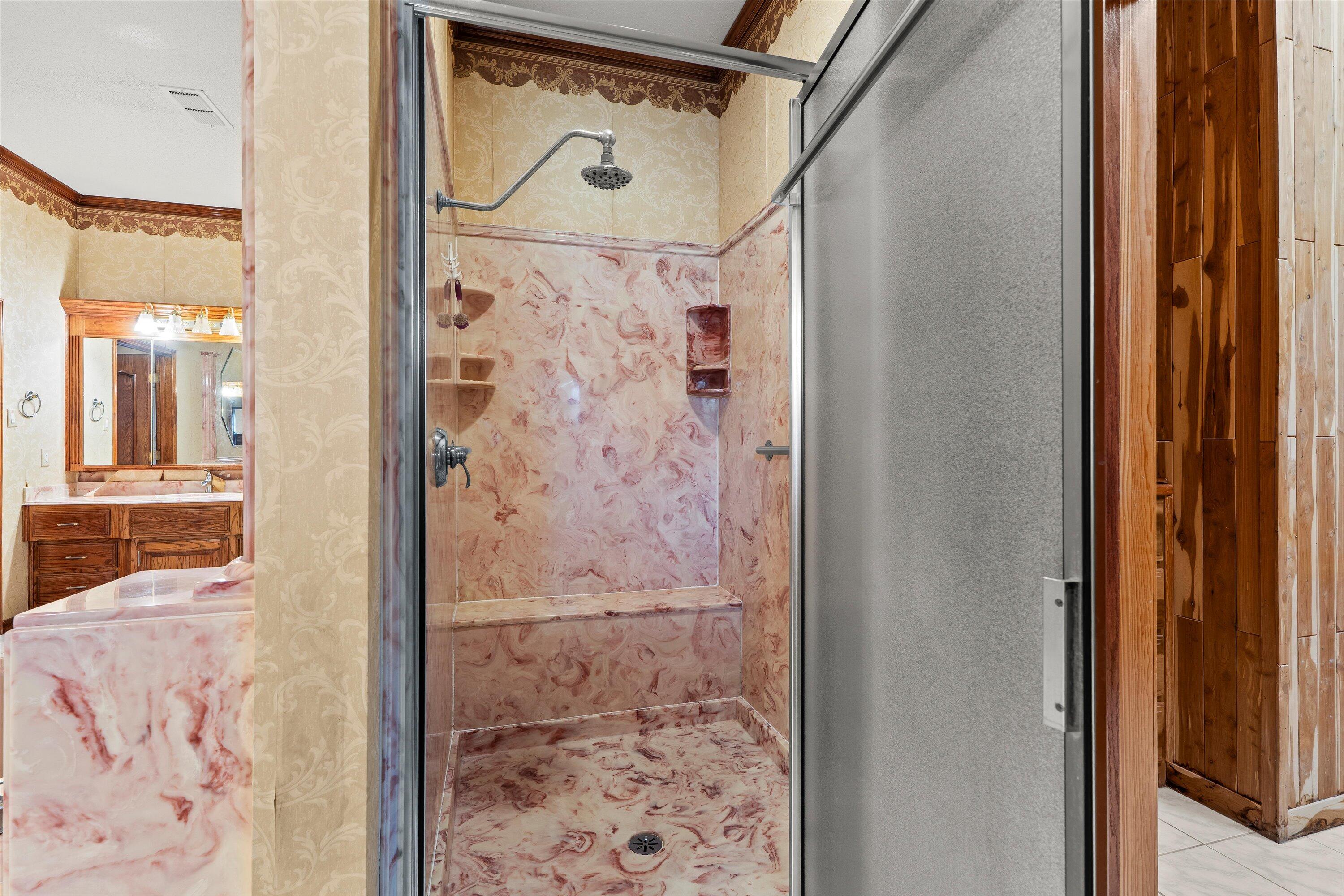 2404 York Avenue Lubbock, TX 79407 - Photo 28 of 88 a bathroom with a glass shower door and a shower