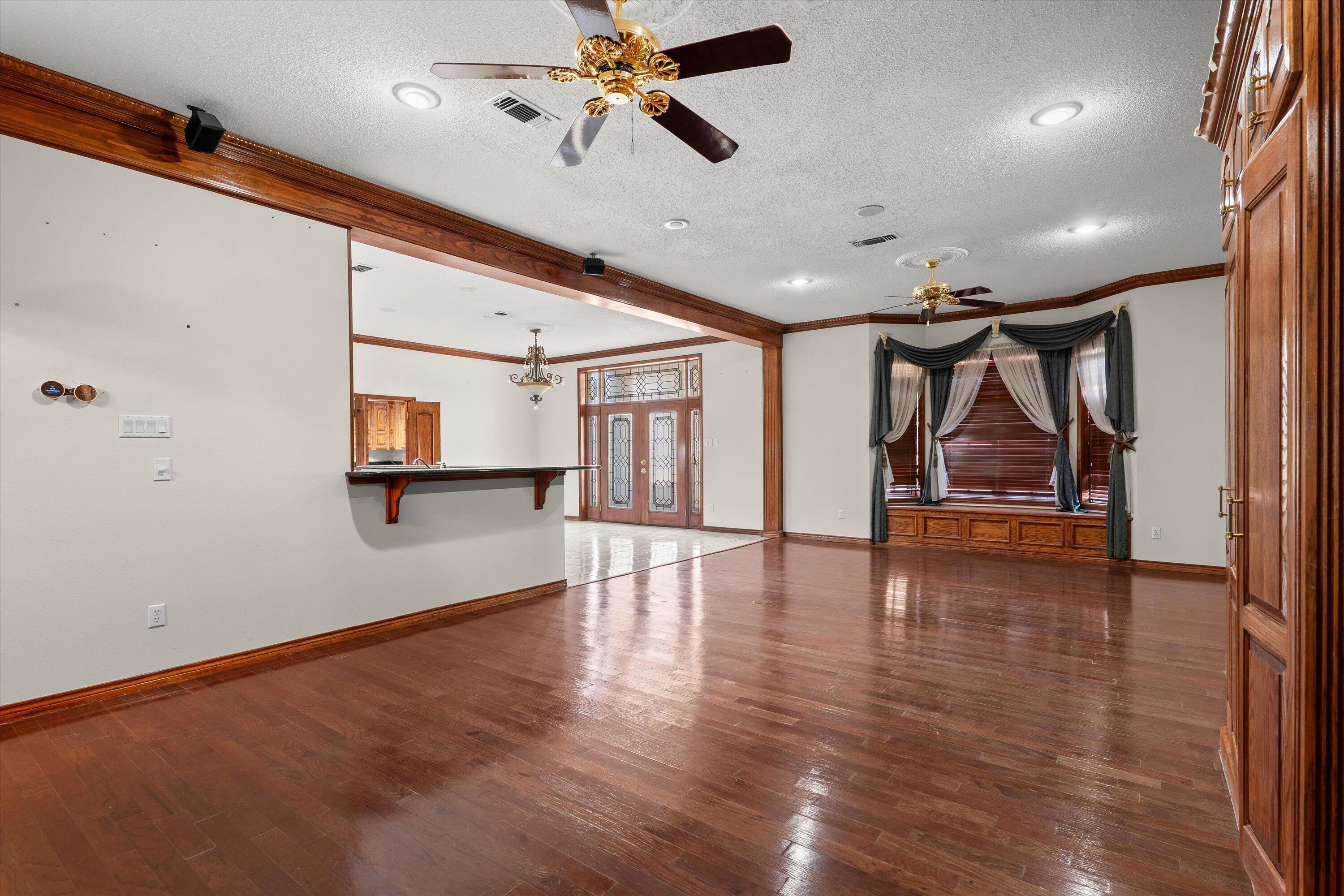 2404 York Avenue Lubbock, TX 79407 - Photo 4 of 88 a view of room and hall with wooden floor