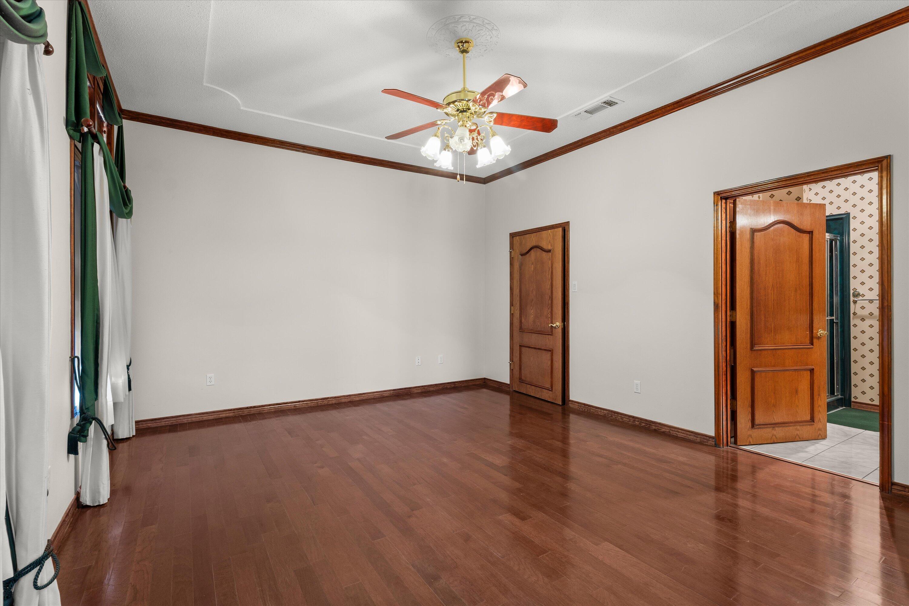 2404 York Avenue Lubbock, TX 79407 - Photo 46 of 88 an empty room with wooden floor and closet