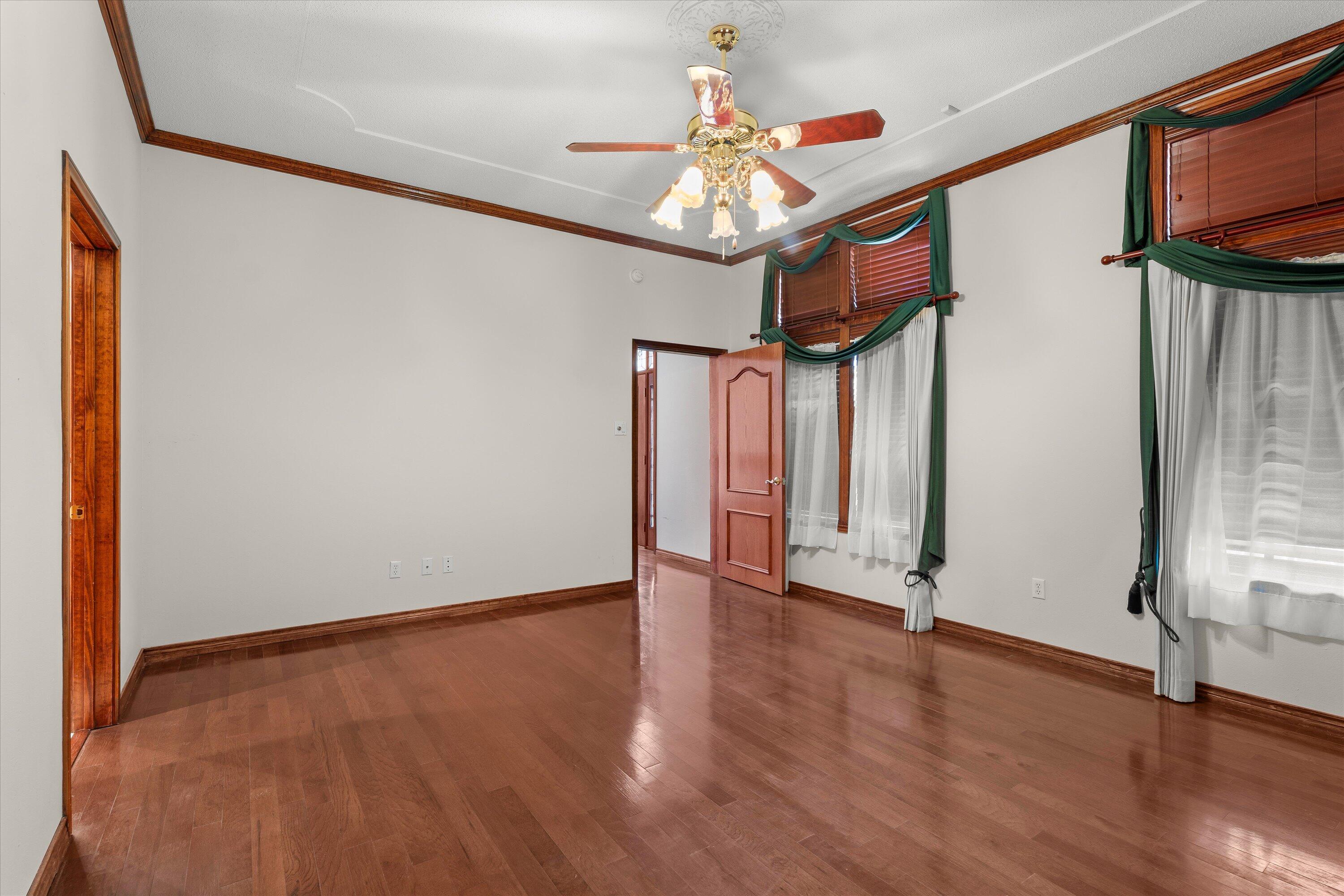 2404 York Avenue Lubbock, TX 79407 - Photo 47 of 88 a view of an empty room with wooden floor and a window