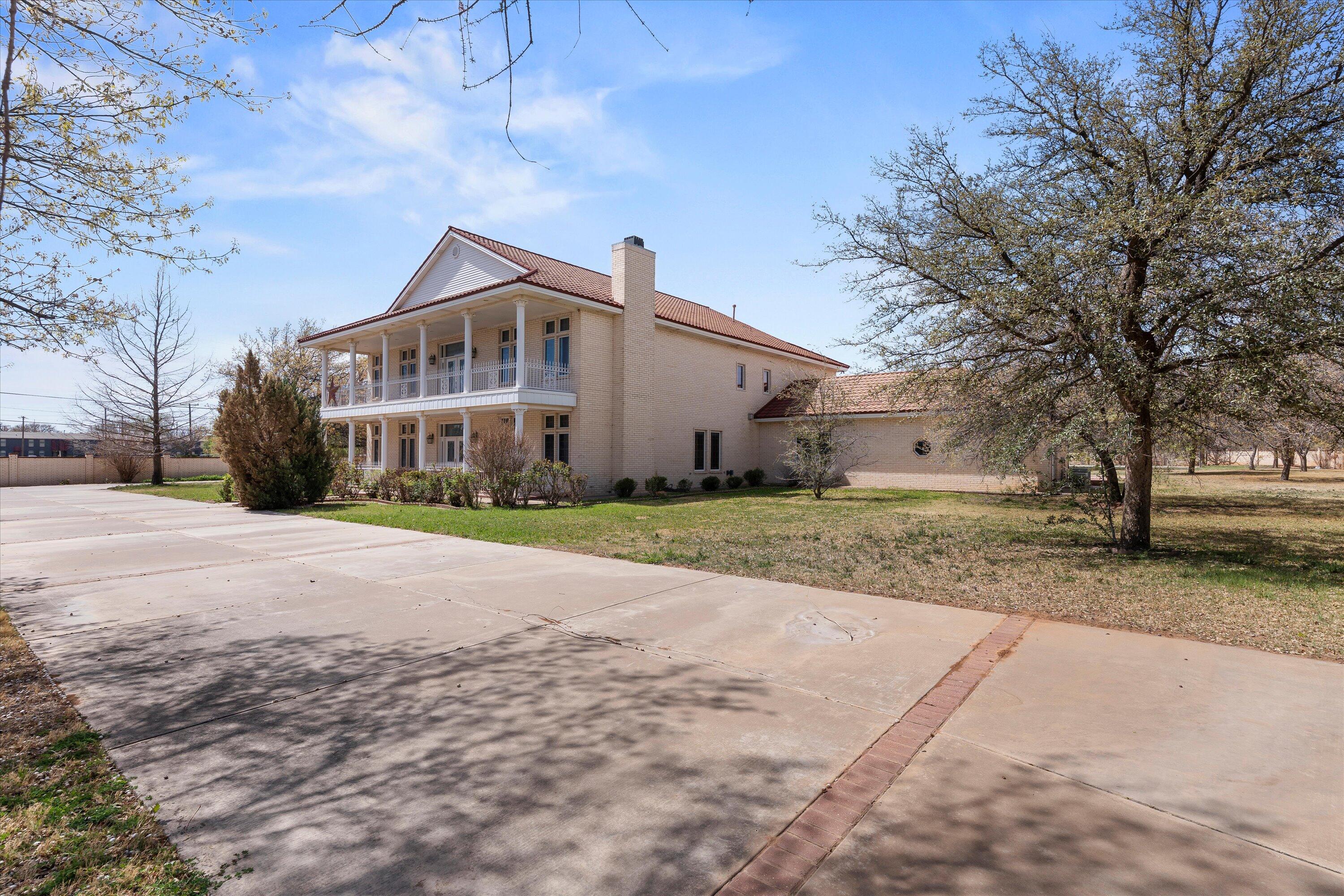 2404 York Avenue Lubbock, TX 79407 - Photo 51 of 88 a front view of a house with a yard and garage
