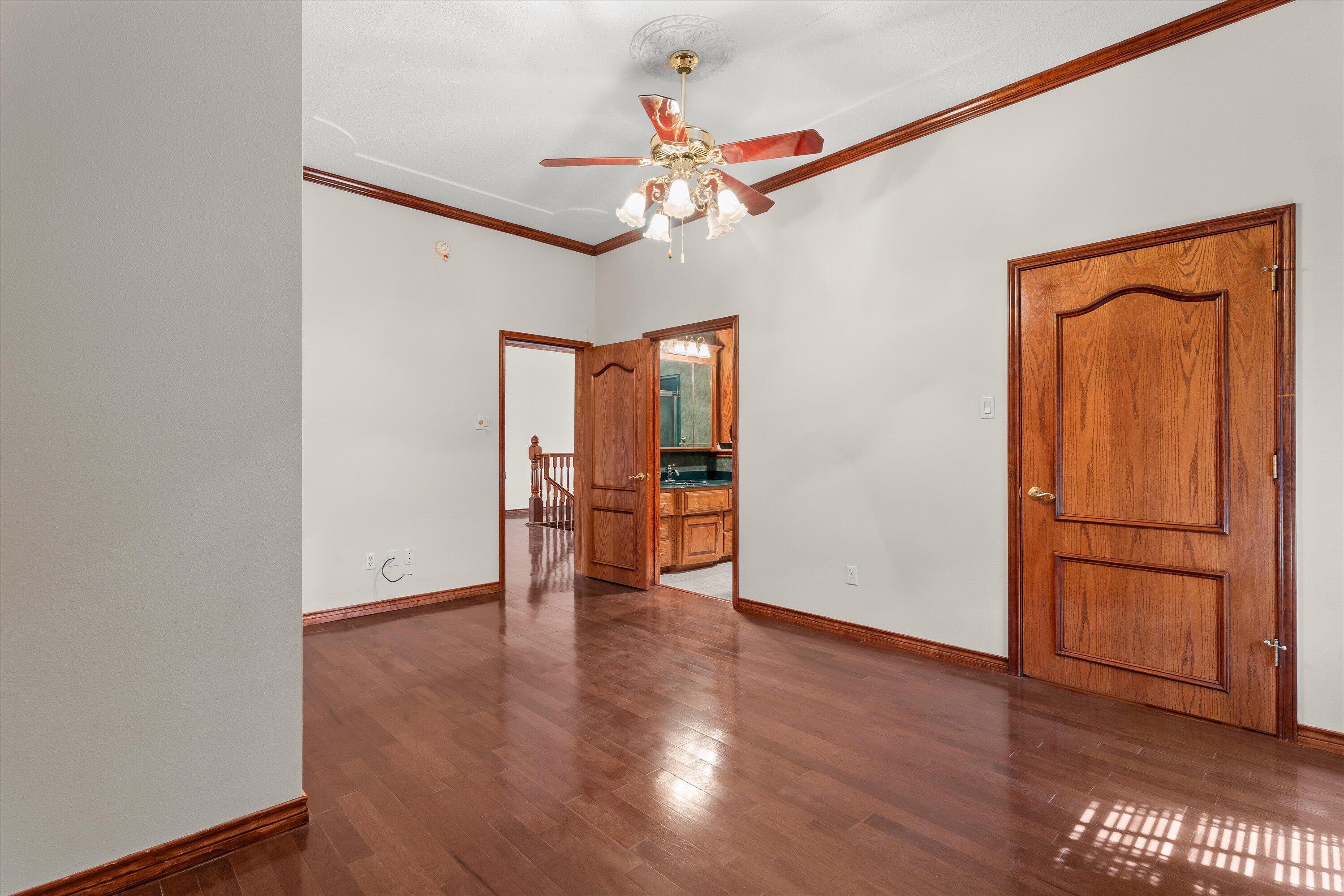 2404 York Avenue Lubbock, TX 79407 - Photo 54 of 88 a view of an empty room with wooden floor and a window