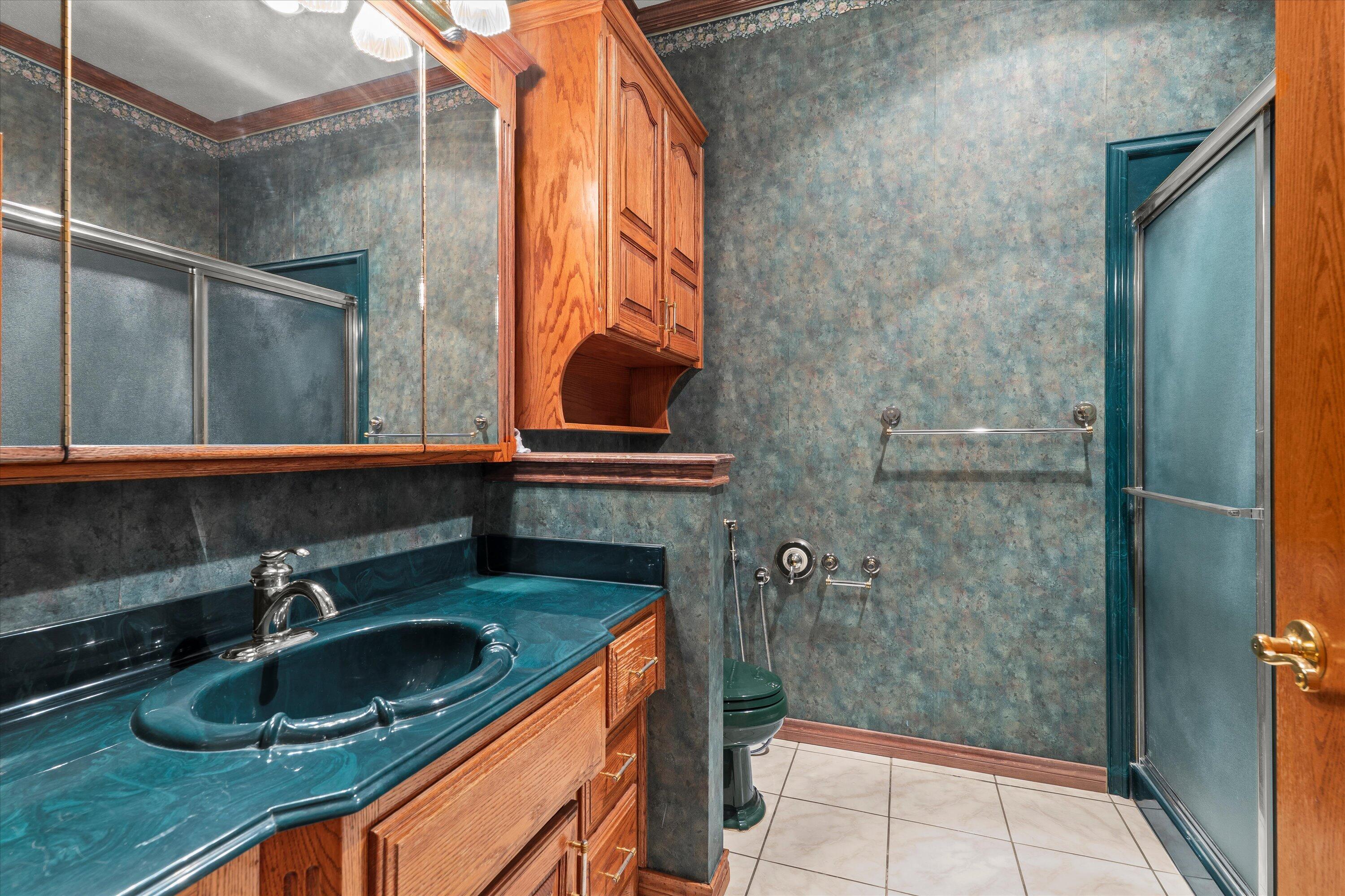 2404 York Avenue Lubbock, TX 79407 - Photo 55 of 88 a bathroom with a sink and a mirror