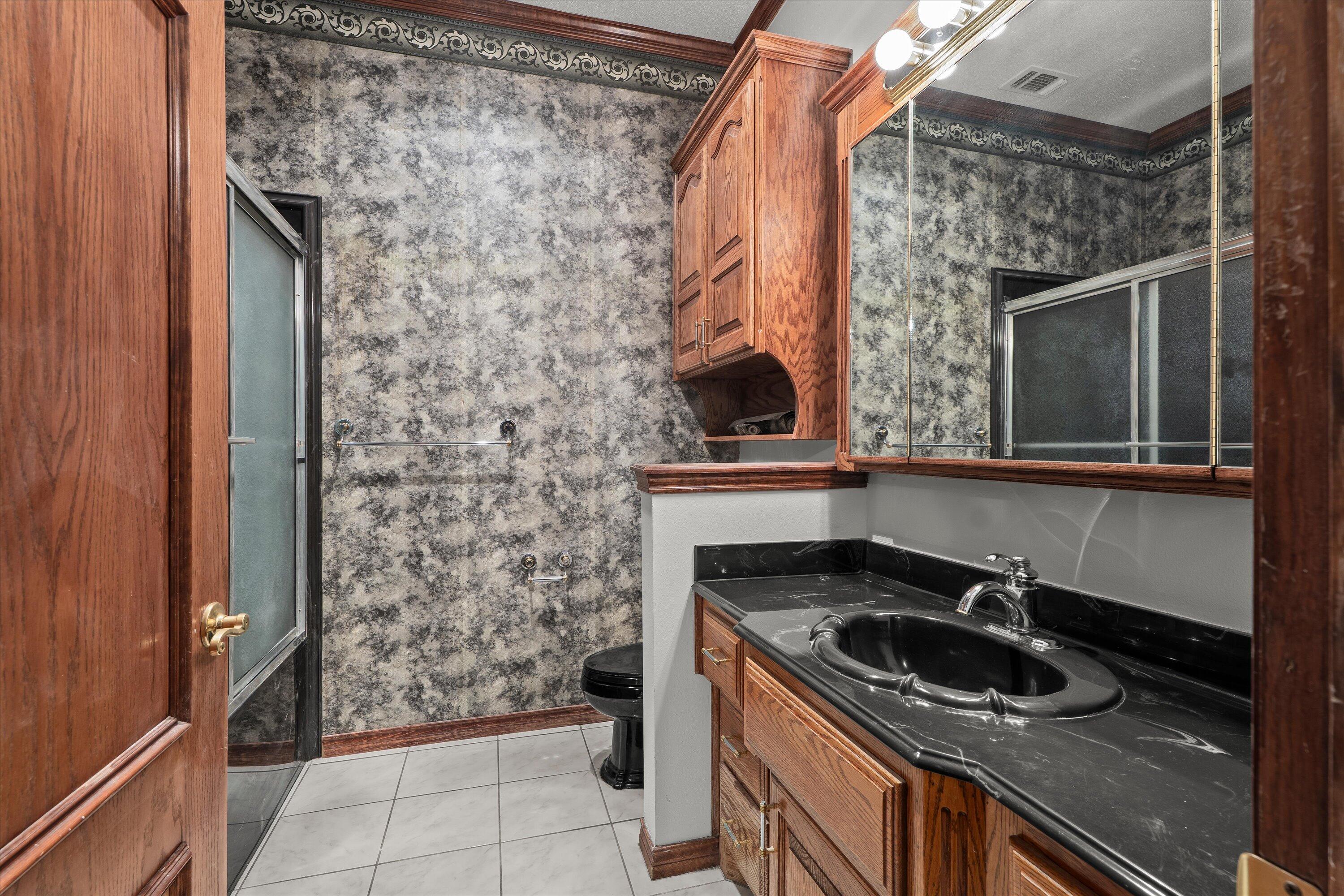 2404 York Avenue Lubbock, TX 79407 - Photo 58 of 88 a kitchen with a sink and a stove top oven