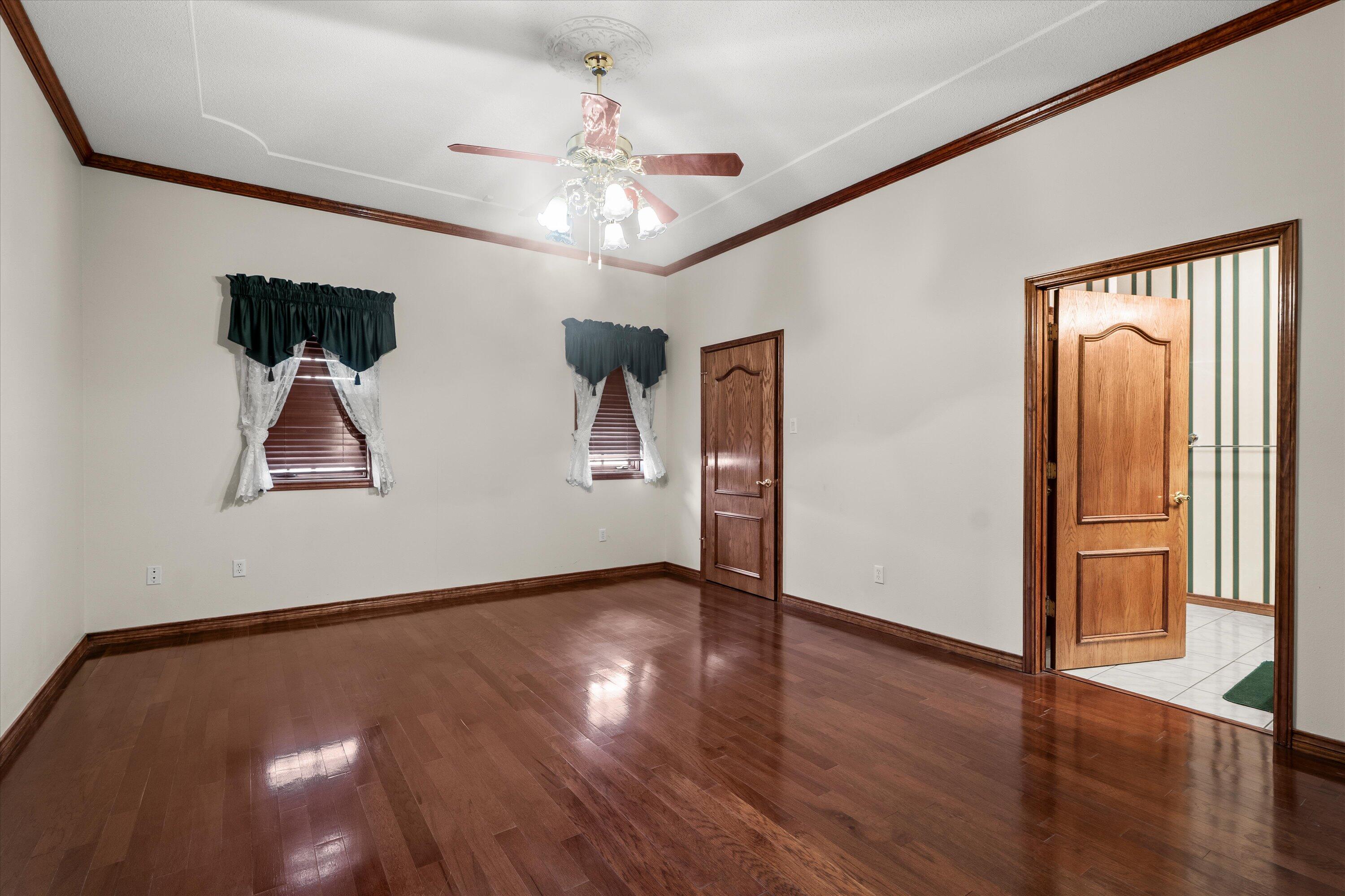 2404 York Avenue Lubbock, TX 79407 - Photo 59 of 88 a view of an empty room with wooden floor and a window
