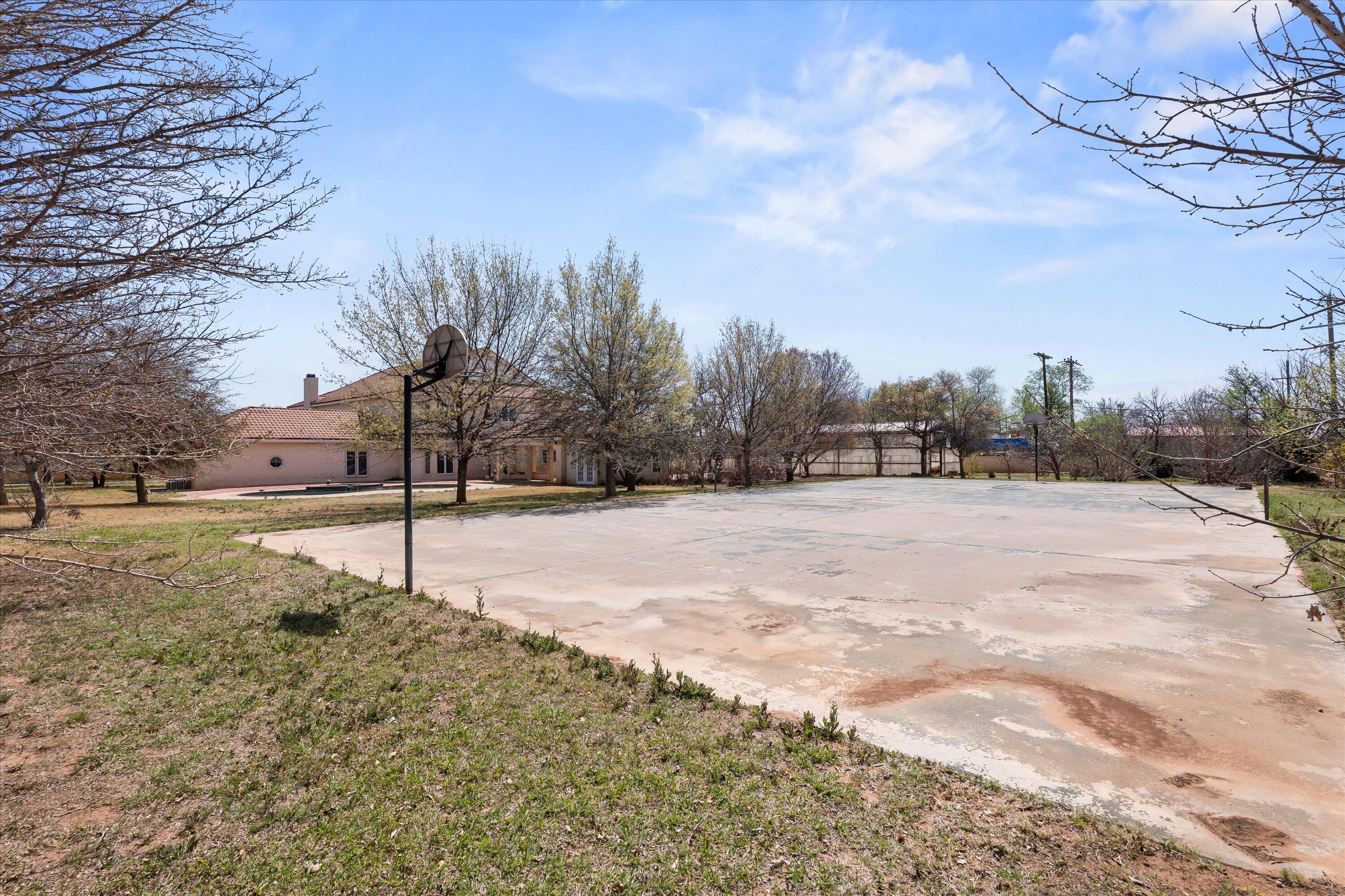 2404 York Avenue Lubbock, TX 79407 - Photo 83 of 88 a view of dirt yard with a large tree