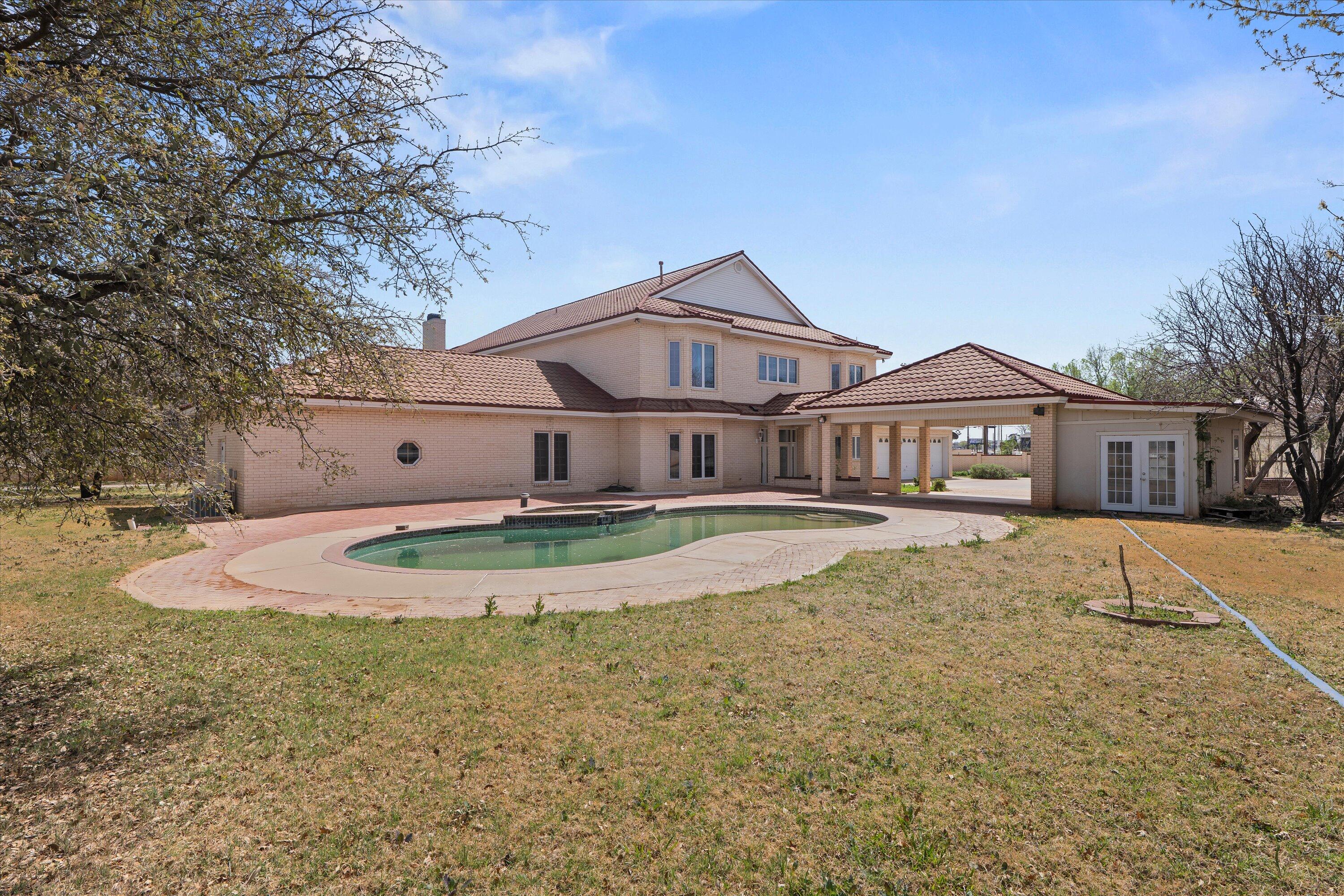 2404 York Avenue Lubbock, TX 79407 - Photo 84 of 88 a front view of a house with a yard