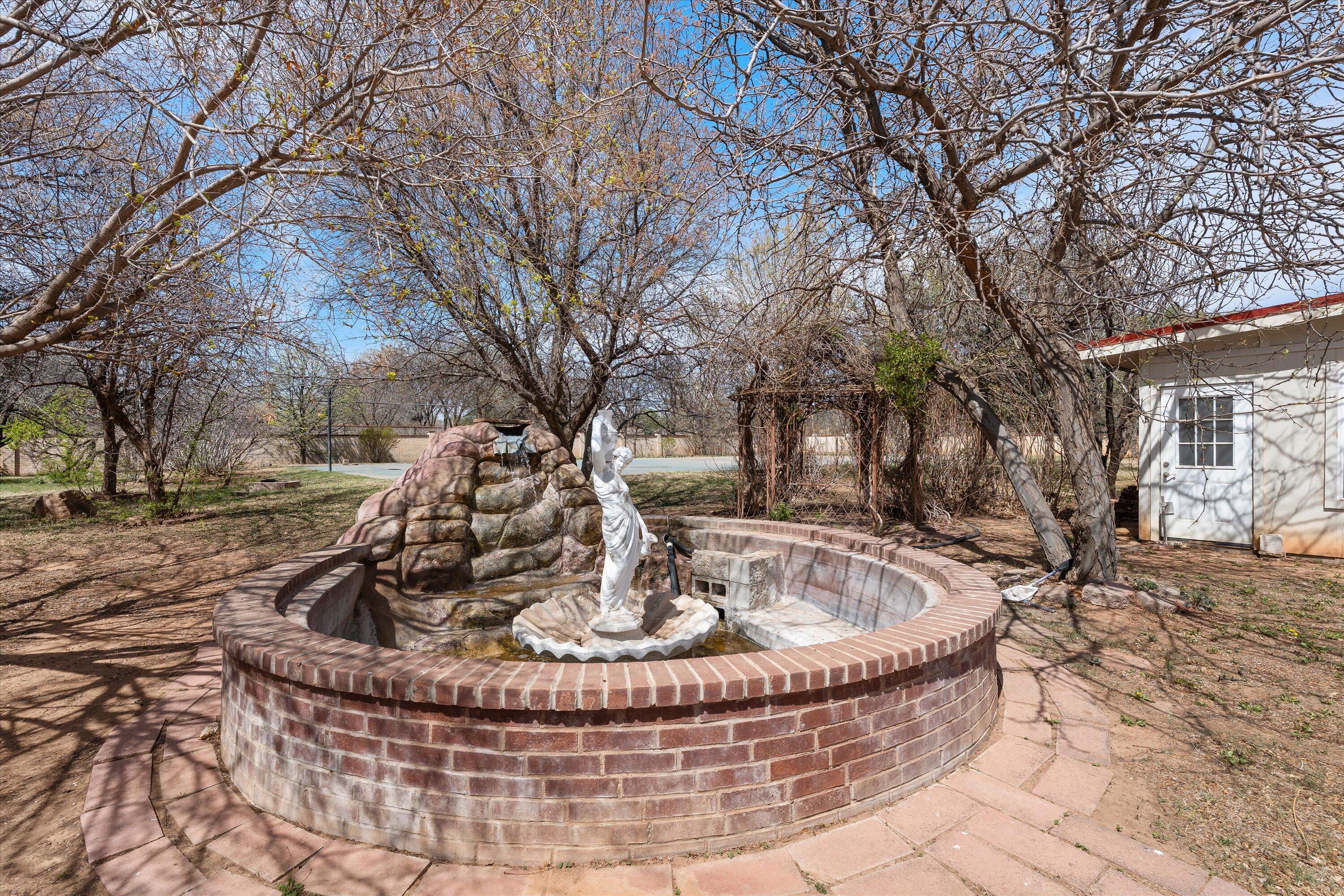2404 York Avenue Lubbock, TX 79407 - Photo 85 of 88 a view of a house with a yard fire pit and outdoor space