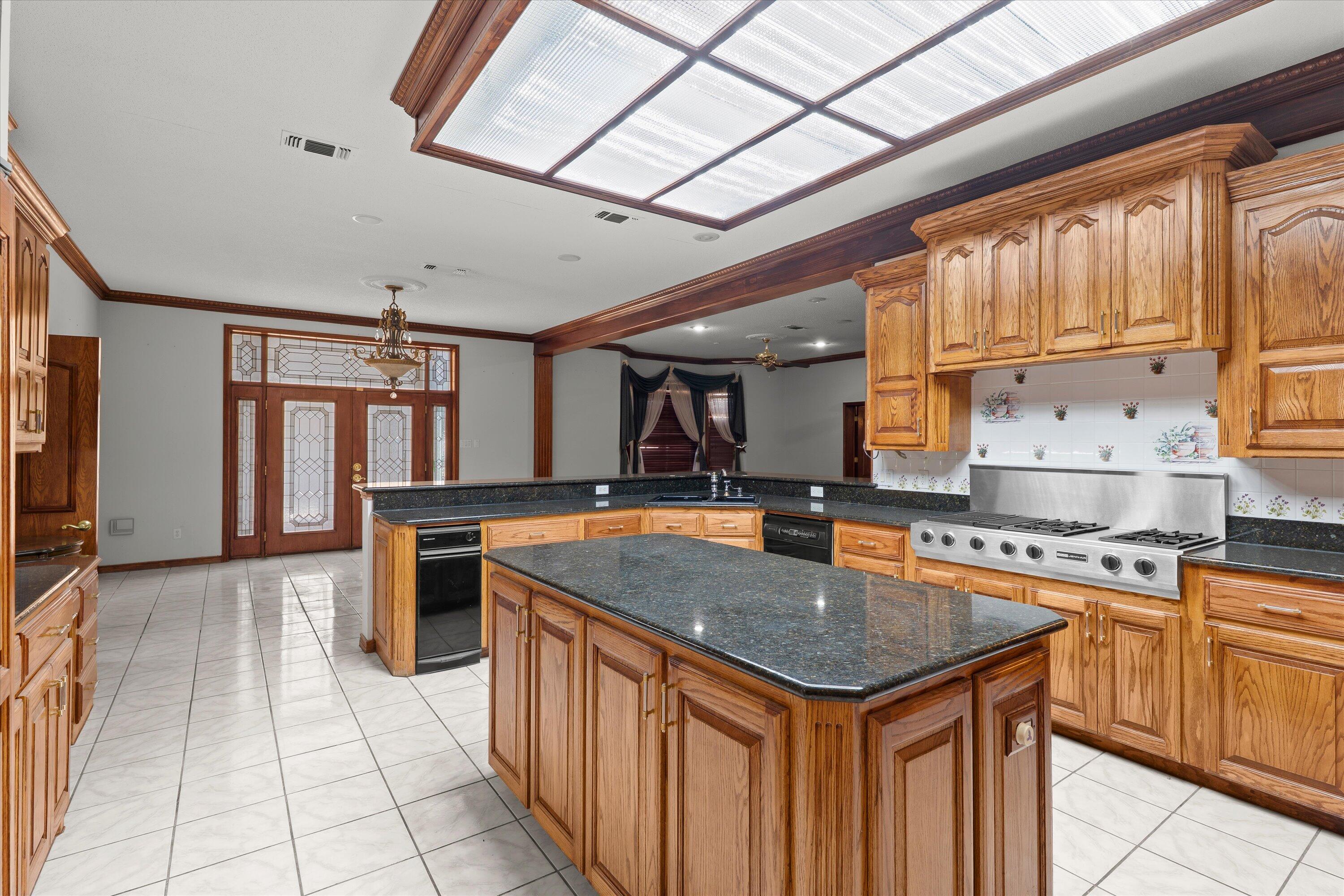 2404 York Avenue Lubbock, TX 79407 - Photo 10 of 88 a kitchen with stainless steel appliances granite countertop a sink stove and cabinets