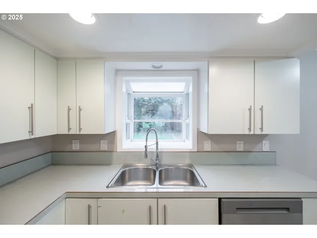 a view of an empty room and wooden floor