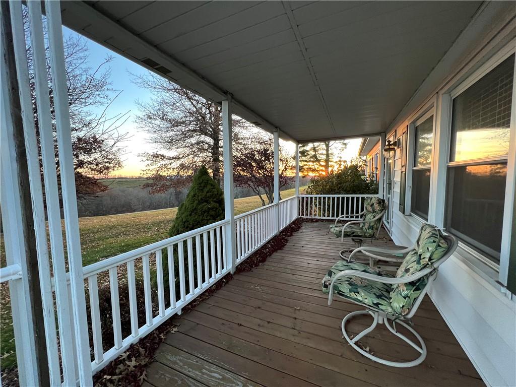 53 Ealy Road West Alexander, PA 15376 - Photo 8 of 25 a view of a porch with wooden floor chairs and stairs