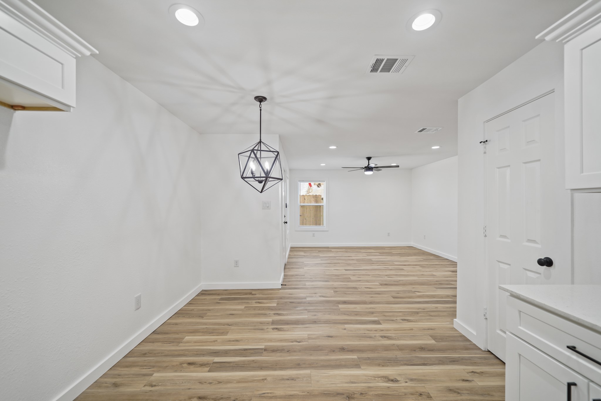 4154 Erby Street Houston, TX 77087 - Photo 11 of 36 a view of empty room with wooden floor and window
