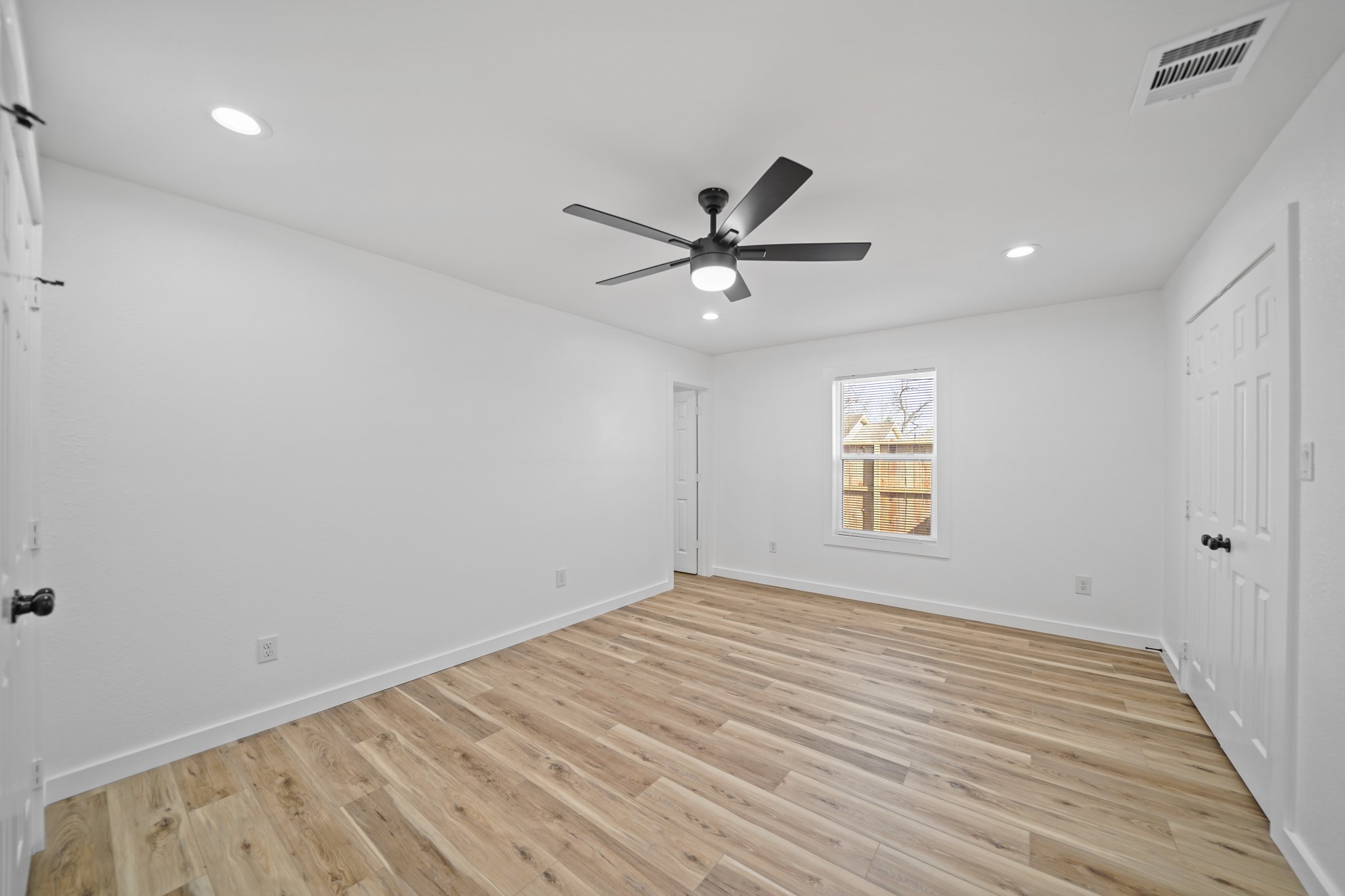 4154 Erby Street Houston, TX 77087 - Photo 16 of 36 wooden floor in an empty room with a window