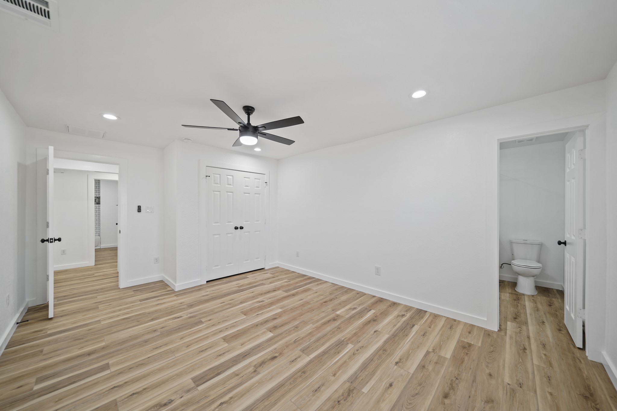 4154 Erby Street Houston, TX 77087 - Photo 17 of 36 wooden floor in an empty room with a window