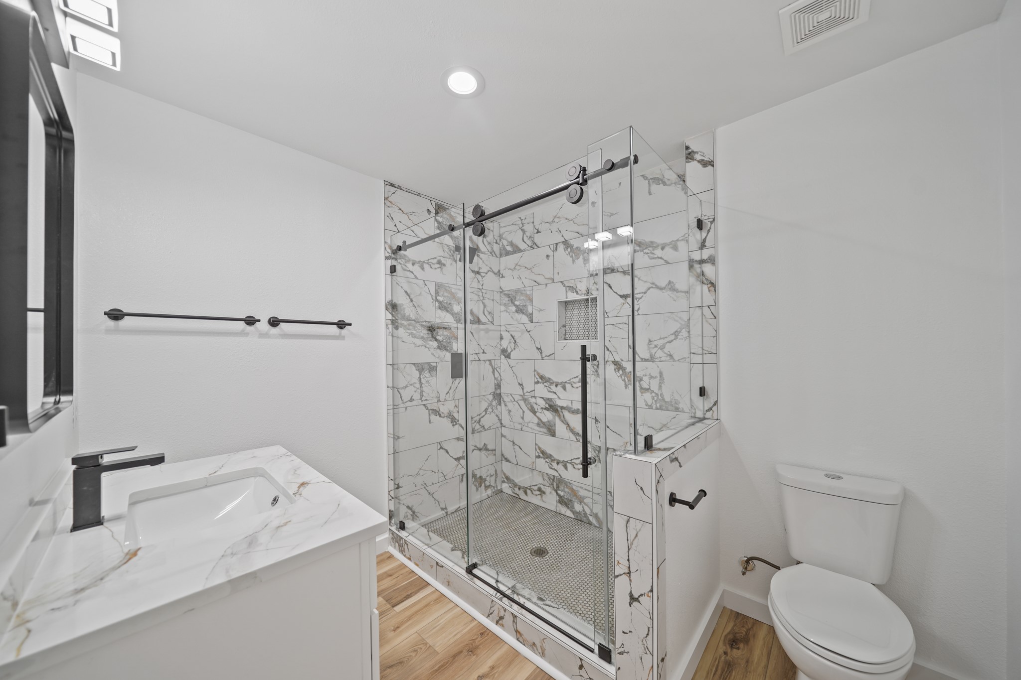 4154 Erby Street Houston, TX 77087 - Photo 18 of 36 a bathroom with a sink toilet and shower